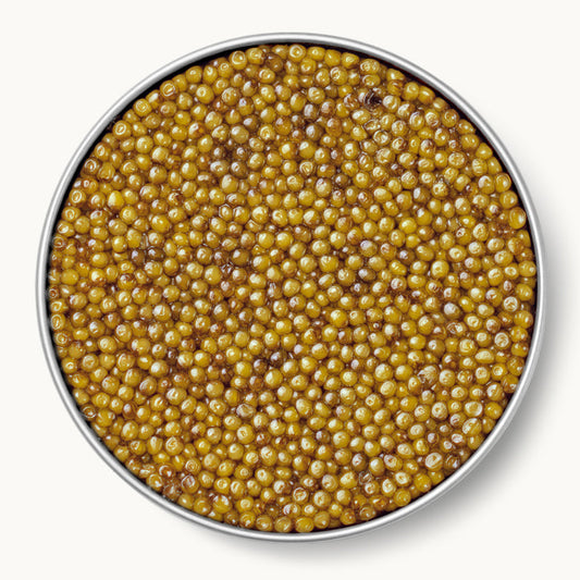 Almas Osetra caviar — rare, pale golden pearls with a delicate buttery flavor, in a Caviar Russe tin